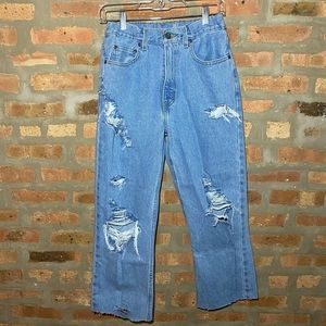 Women’s denim jeans with rips and adjustable waist